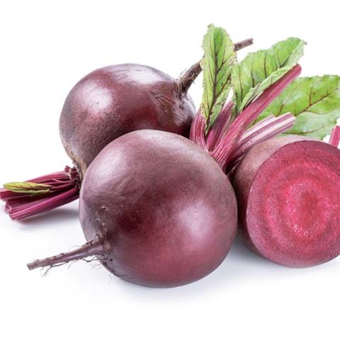 Fresh beet roots with green stems on white background - natural nitrate source for blood flow and stamina